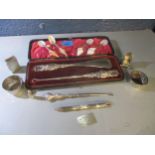 A mixed lot of silver items to include a cased silver handled button hook and shoe horn,