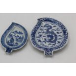 Two Chinese, Qing, 18th/19th century blue and white leaf dishes, one decorated with a dragon and