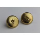 A pair of 9ct gold earrings of button design with applied leaf ornament, pin and clip backs, 5.7g