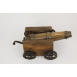 A 19th century signal cannon, with a bronze barrel and metal handle, with later wooden sides and