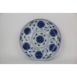 A Chinese Qing, Guangxu period blue and white dish, decorated with seven flowers heads and bats