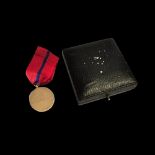 A 9ct gold early 20th century Target Shooting medal having a pair of crossed rifles below a
