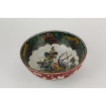 A late 19th/early 20th century Japanese bowl decorated to the interior with a cockerel and