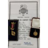 A 9ct gold railway medal, 7.3g with associated certificate and a cased Order of Foresters medal