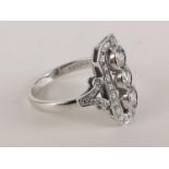 An 18ct white gold Art Deco style ring with three central diamonds