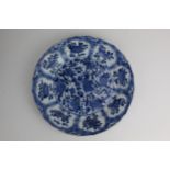 A Chinese Kangxi Kraak blue and white plate, decorated to the centre with flowers, within a border