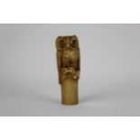 A Japanese, late Edo period carved ivory seal fashioned as an owl on a log, with mother of pearl and