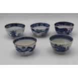 Five Qing, 18th century Chinese blue and white tea bowls, each decorated with a river landscape,