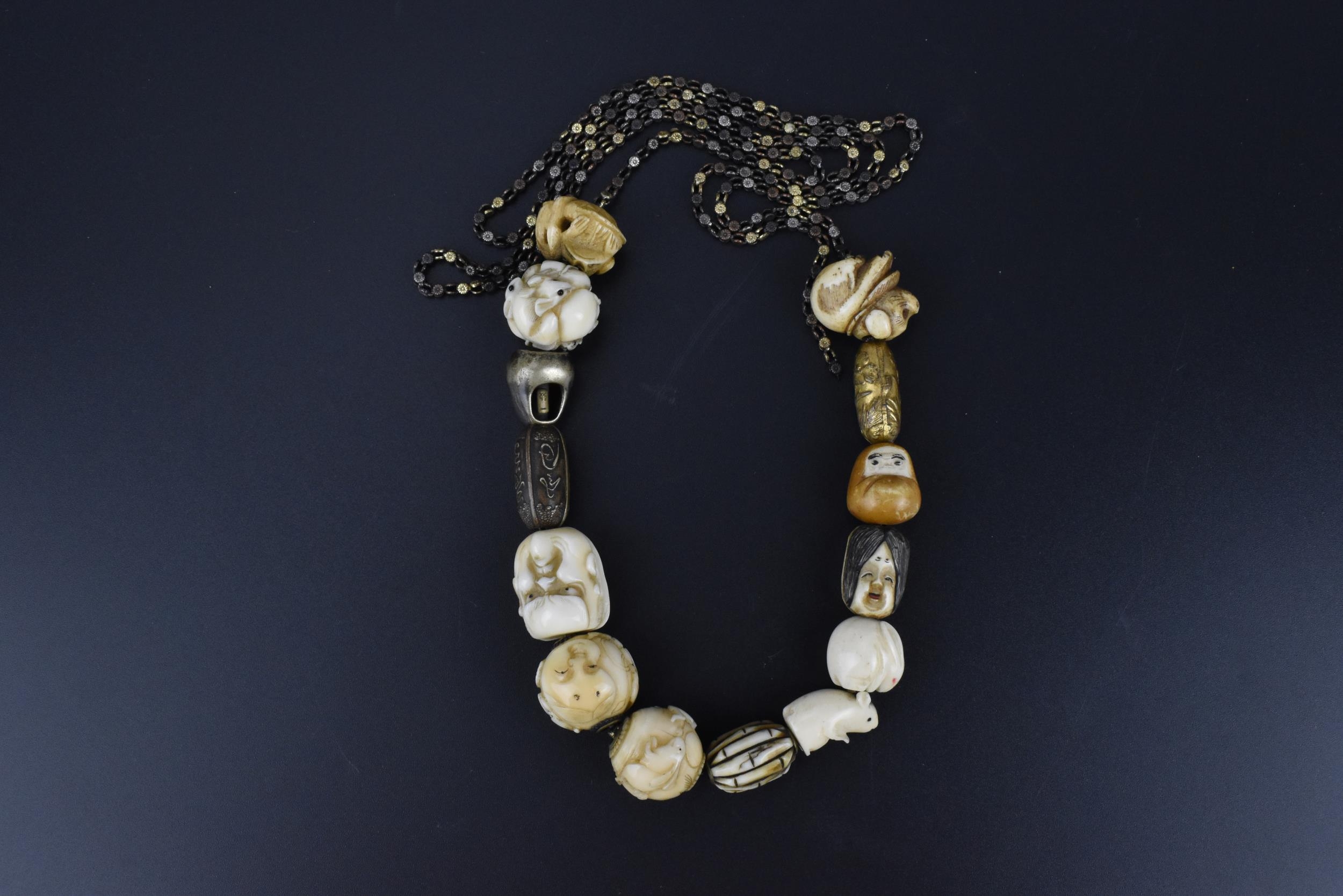 A 19th century Japanese ojime bead necklace, with carved ivory, bone, and metal ojimes, modelled - Bild 2 aus 7