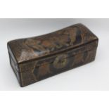 A 20th century Chinese gold, green and brown painted leather opium pillow box, decorated with bats