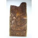 A Pacific Island, late 20th century carved hardwood panel depicting a village ceremony by the water,