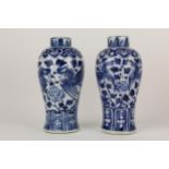 A pair of Chinese, late Qing, blue and white Meiping vases, decorated with lapels to the neck, a