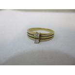 An 18ct gold diamond two stone ring, 3.1g