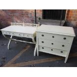 A reproduction light stained chest of three long drawers together with a side table Location: