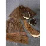 Vintage furs to include a brown ermine cape and a rabbit cape, together with a rabbit fur hat and