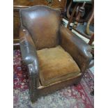 An early 20th century leather upholstered stud back armchair Location: