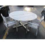 A garden teak circular table 74.5cm h x 150cm w, together with two John Lewis teak chairs Location: