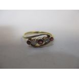 An 18ct gold diamond and ruby set ring, 2.3g