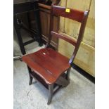 A reproduction mahogany metamorphic library chair/steps Location: