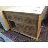 A modern pine kitchen island having a single fall flap with drawers and cupboards 89.5cm h x 123.5cm