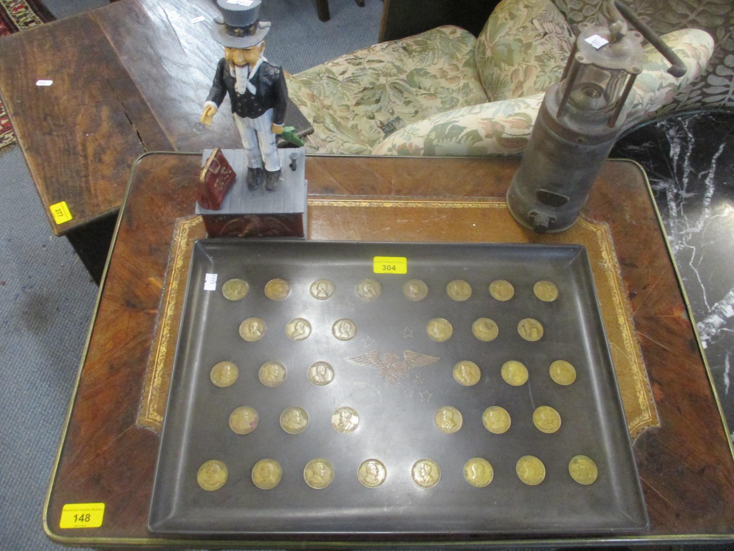 A Couroc's satin finish black plastic tray inset with American coins commemorating the Presidents of