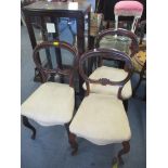 A set of three Victorian rosewood balloon back dining chairs together with a reproduction display