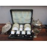 A Salon china coffee set with silver plated bean terminal spoons cased, a silver plated basket and