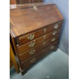 A Georgian oak low drop leaf table, together with an early 20th century mahogany reproduction bureau