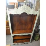 A French style painted open bookcase with acorn shaped finials with floral decoration and five