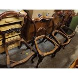 A matched set of eight Victorian rosewood dining chairs having scroll decoration and on cabriole