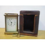 An early 20th century brass cased carriage clock in a brown leather clad carrying case Location: