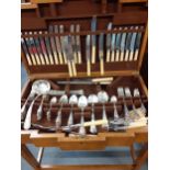 An Art Deco oak cutlery table containing a canteen of silver plated cutlery, 12 setting Location: