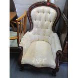 A Victorian style mahogany and beige upholstered serpentine fronted spoon back armchair Location: