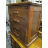 A mid 20th century oak chest of four long drawers on a plinth base 78cm h x 68.5cm w, together
