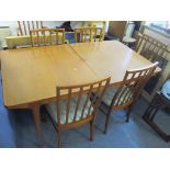 A 1970's McIntosh teak extending dining table, 73.5cm h x 160cm w, together with six matching dining