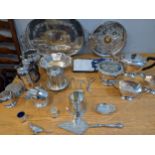 Silver plate to include a three piece tea set, a small biscuit barrel, trays, flatware and other