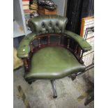 A late 20th century mahogany and leather revolving desk chair Location: