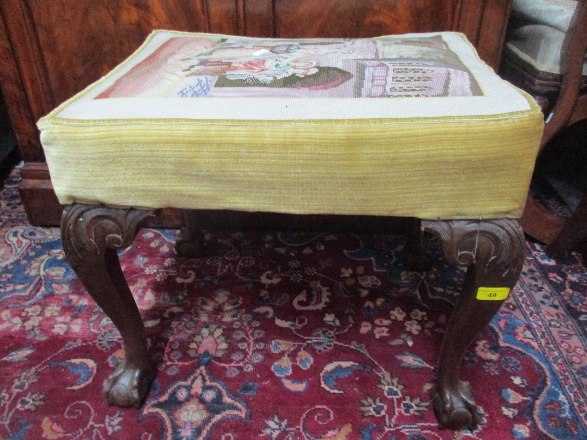 An early 20th century mahogany tapestry topped stool standing on ball and claw feet, 49cm h x 56.5cm