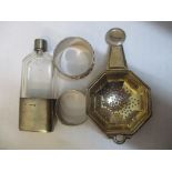 Mixed silver to include a strainer, two napkin rings and a glass and silver bottle Location: