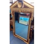 A reproduction gold painted pier mirror with rococo design and part wooden frame, 100cm hi x 58cm