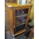 A late Victorian burr walnut pier cabinet having string inlaid and single glazed door 95cm h x 56.