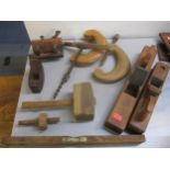 A quantity of woodworking tools to include large planes, clamps, spirit level and other items