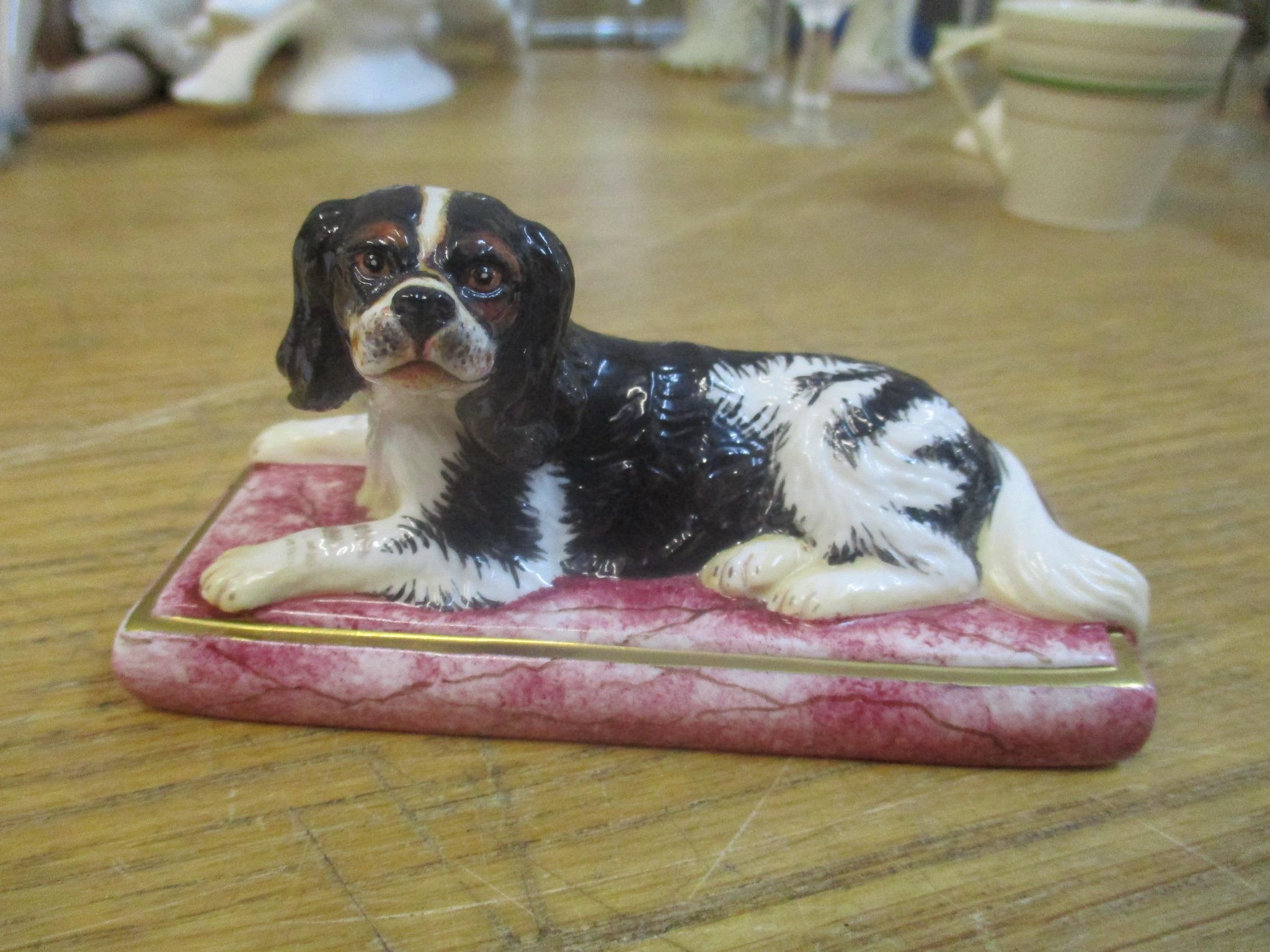 A Halcyon Days ornament of a King Charles Spaniel, initialled ATJ to the underside Location: