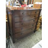 An early Victorian mahogany bow fronted chest of two short and four graduating low drawers flanked