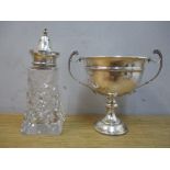 A silver trophy cup and a silver topped glass sugar caster, 103g of silver