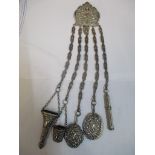 A Victorian silver plated chatelaine to include accessories such as an aide memoire, thimble case