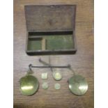 A wooden cased brass goldsmiths scales with various weights to include a George III 5:8 guinea