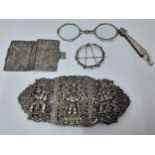 Silver and white metal-An Eastern white metal belt buckle, a pair of white metal lorgnettes, a white