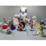 A collection of felt animals in costume to include a pig in a nightdress by Julie Perrin and mice by