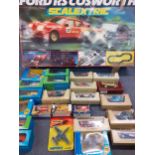 A Scalextric Ford RS Cosworth in original box and boxed die cast collectors vehicles to include